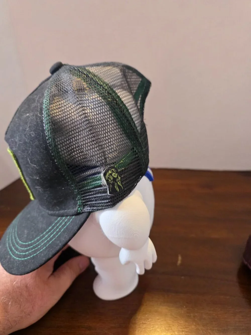 Marvel Comics snapback cap features a black mesh back
